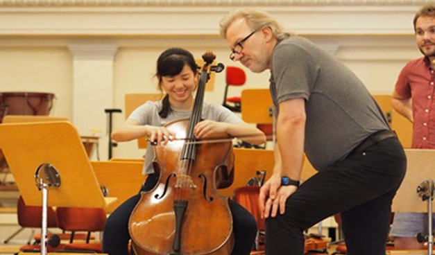 Our Soloist, Yunxi, performed Rococo Variations on the Cello. This picture captures Dirk, KAO’s Conductor, imparting some of his musical knowledge to Yunxi to help her blend with the KAO members.