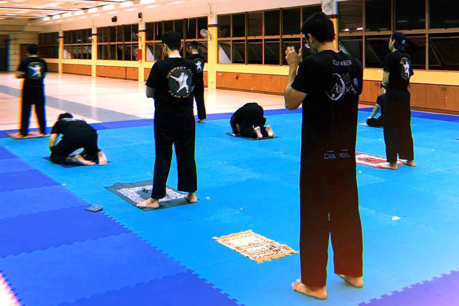 NUS Silat members take a time out in between a training session for the mandatory prayer time called Maghrib. Photo was taken pre-COVID-19. 

