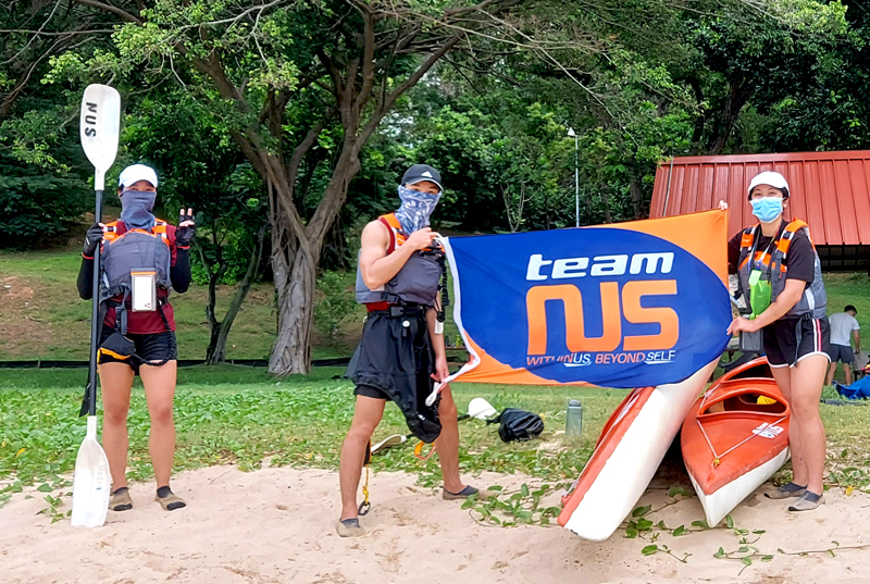 Students spotted holding different poses and even a teamNUS flag
