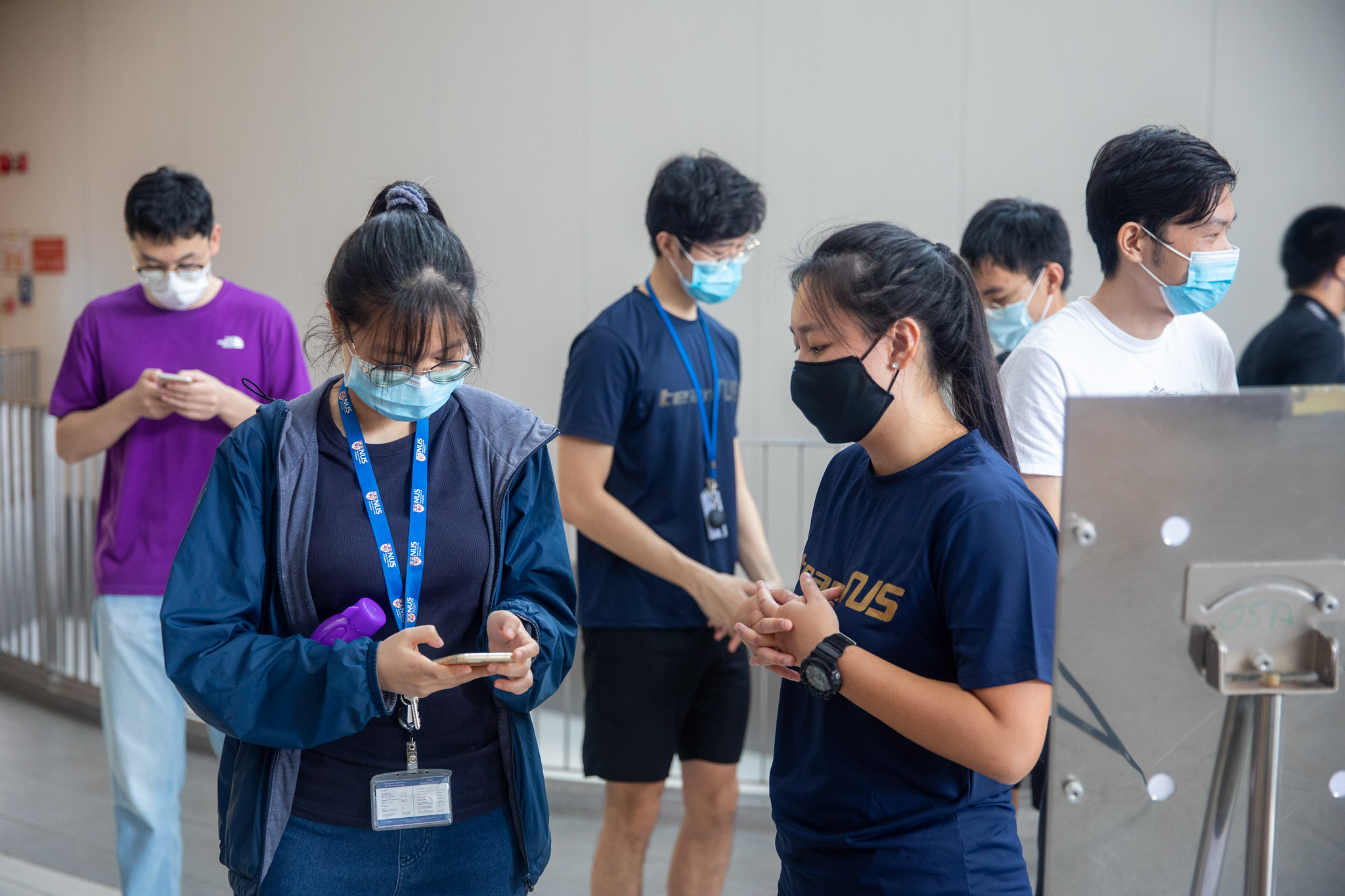 Other NUS Swimming team members in action at the collection point
