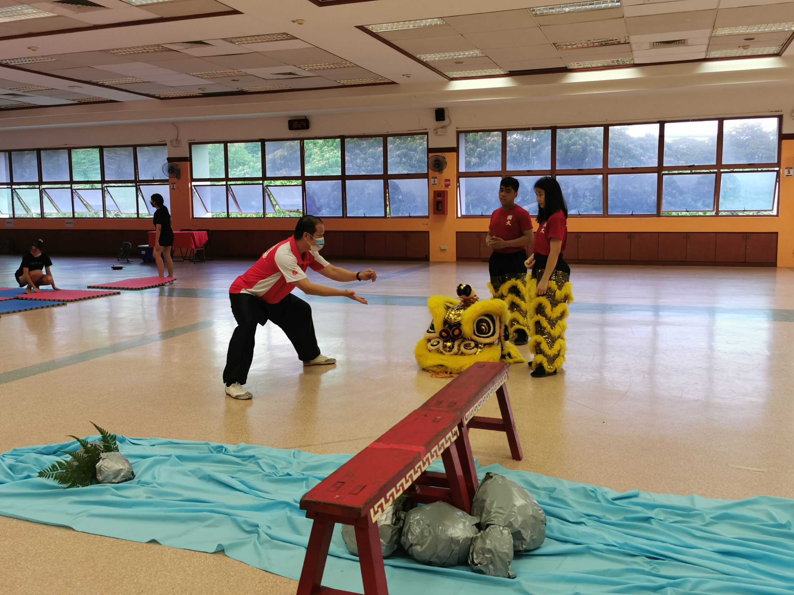 Master Hiew Yun Cheong, an experienced lion dance performer and trainer putting Lion Dancers through the routine
