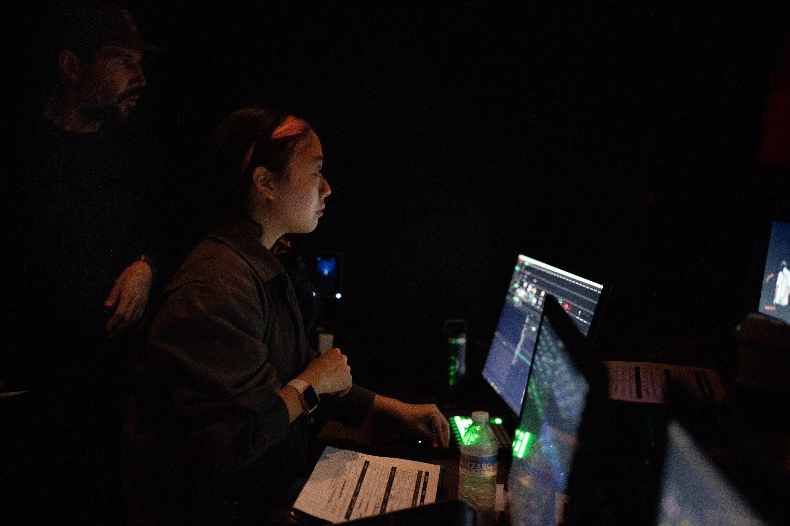 These days, Elicia is deeply involved in show production such as operating the video and lighting console backstage. (Credits: Ryan Nava)

