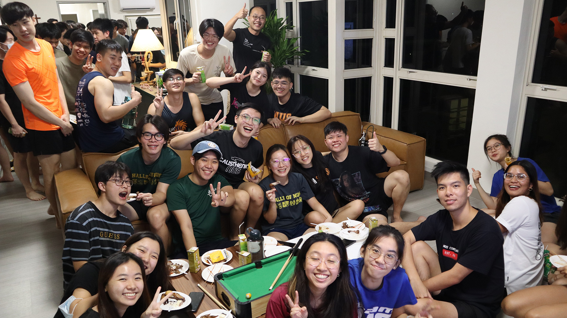 Assoc Prof Chen hosting a supper for LightHouse residents at his Master’s apartment.
