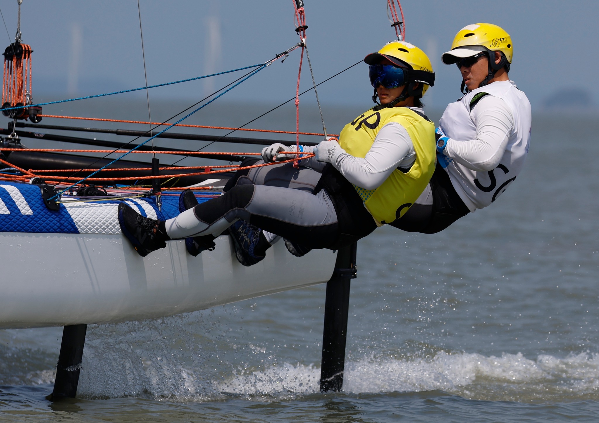 The alumni couple have been sailing for over a decade since their time as undergraduates in NUS. (Photo: Singapore National Olympic Council)
