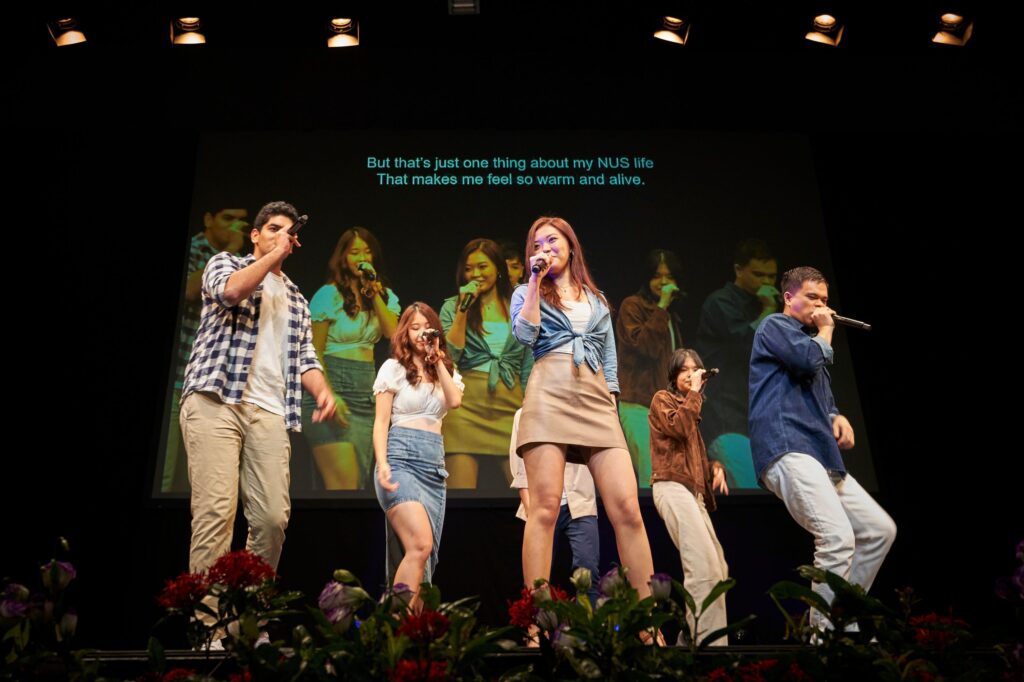 Stephanie (third from right) performed a rap with original lyrics written by Jia Yu in NUS Resonance’s NUS Forever.