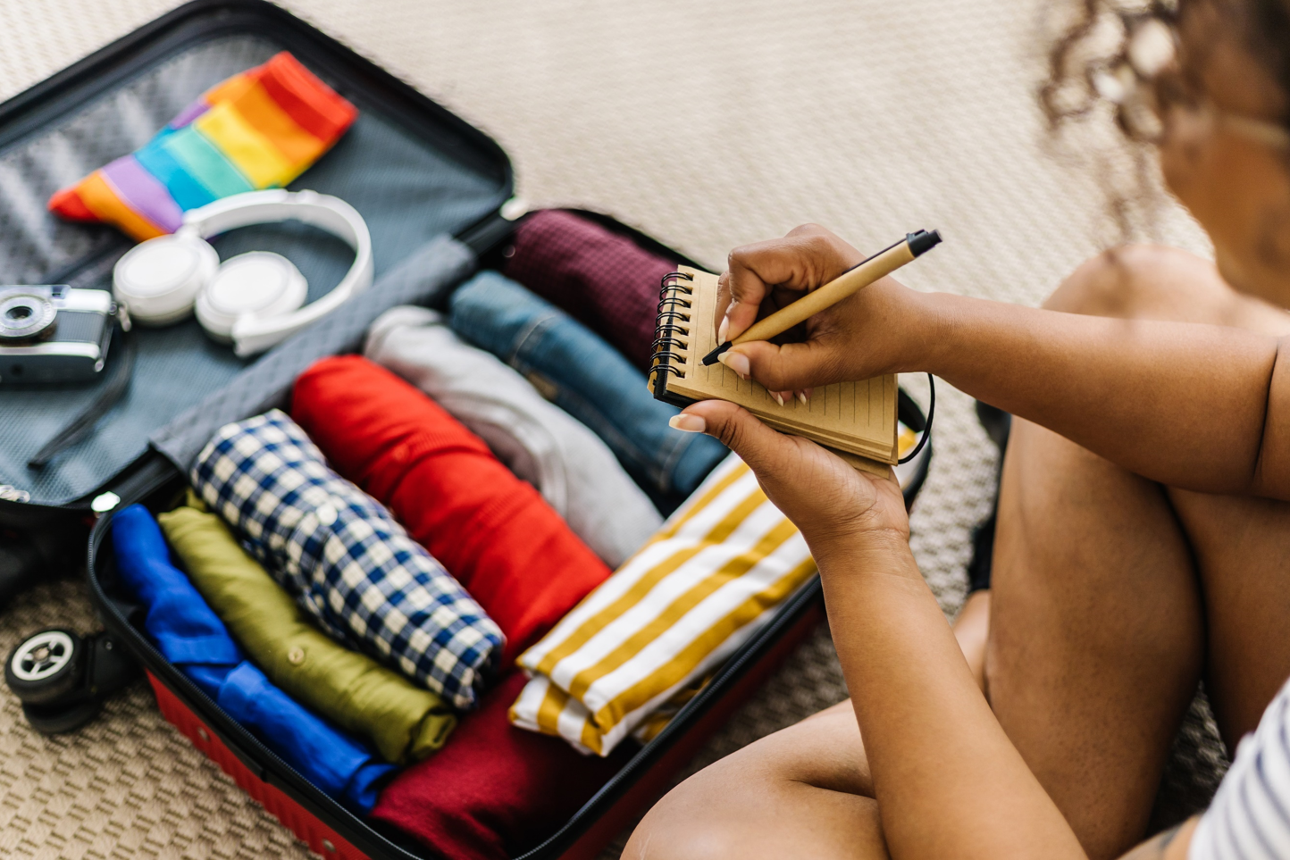 Person packing a suitcase _MS Stock Image
