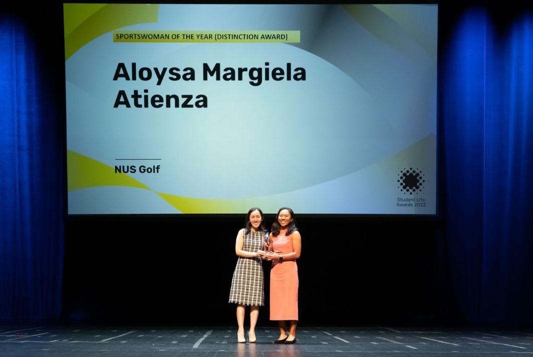 From one sportswoman to another: Aloysa Margiela Atienza (right) received the Sportswoman of the Year Award from NUS alumna and national shooter Jasmine Ser (left).
