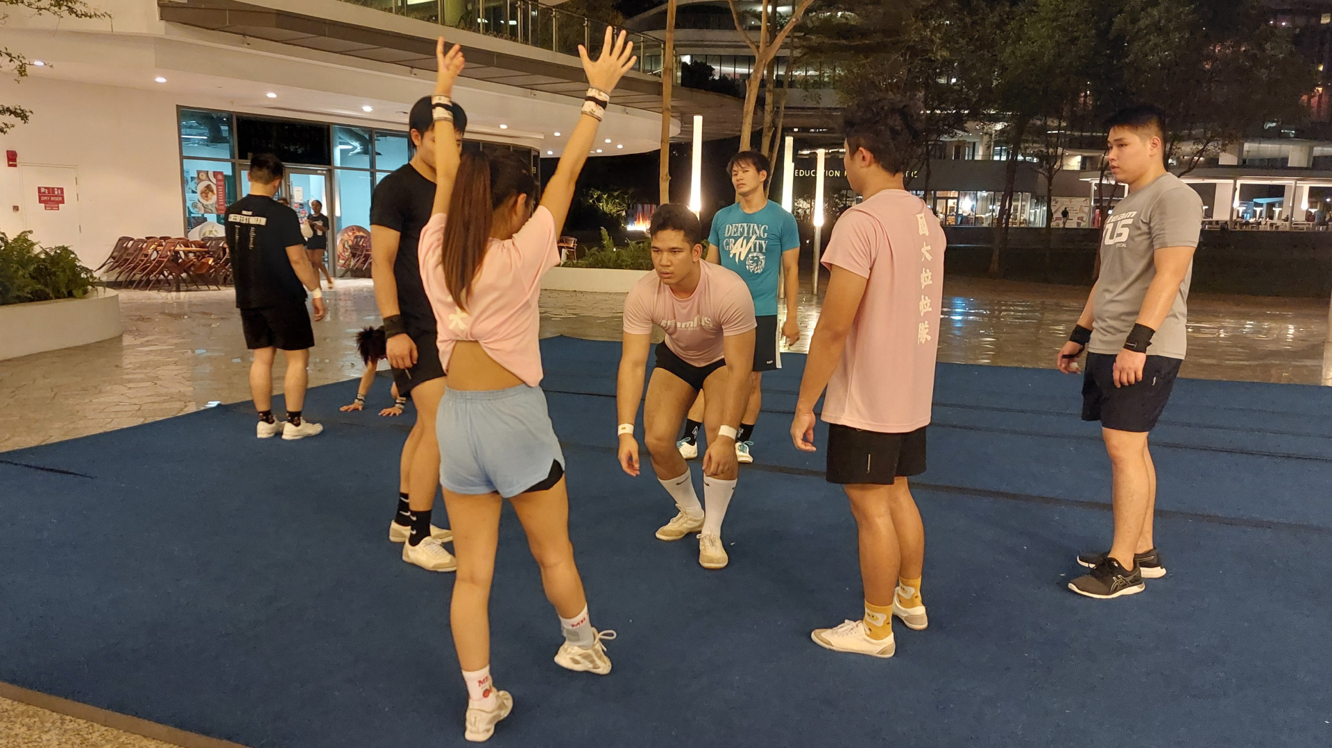 Muhammad Asyraf Bin Abdul Mutaliff (centre) in full concentration, getting ready for a front handspring up stunt at NUS Alpha Verve Cheerleading training.