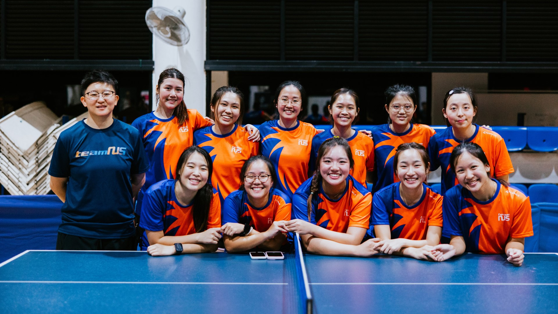 Janine (front row, second from left) with her teammates from the NUS table tennis women’s team at the Singapore University Games (SUniG) 2024/25.