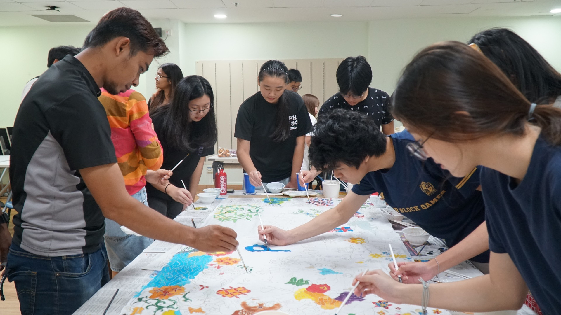 With keen eyes and steady hands, PH students and housekeeping staff worked closely to design and paint their communal batik artwork over two sessions.