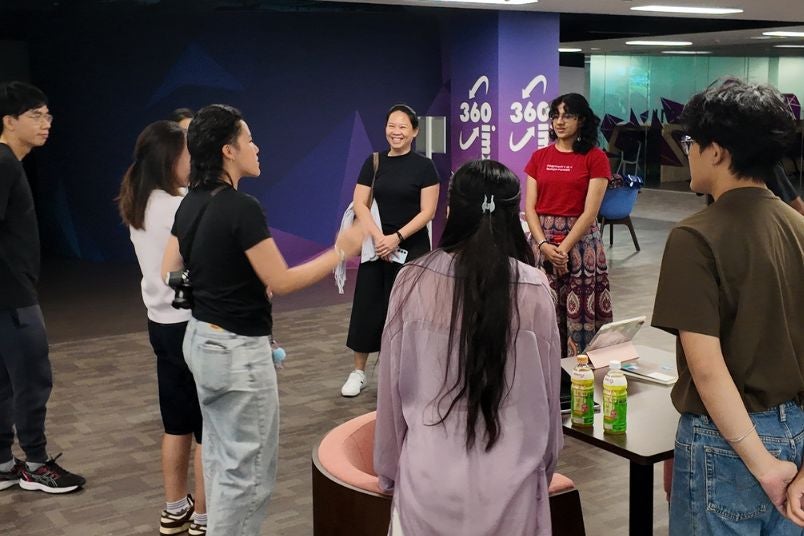 Director, Evangel Wong, introducing the work to Invited Guests before the 75% check-in Director, Evangel Wong, introducing the work to Invited Guests before the 75% check-in