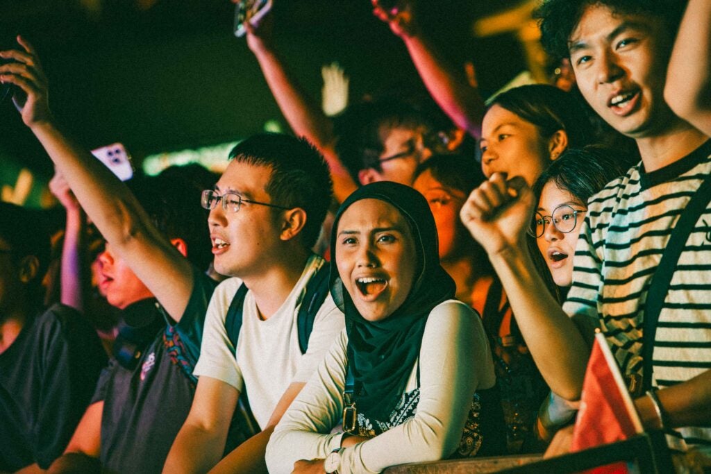 16,000-strong audience voices rose in cheers, swaying to the rhythm at UTown. 