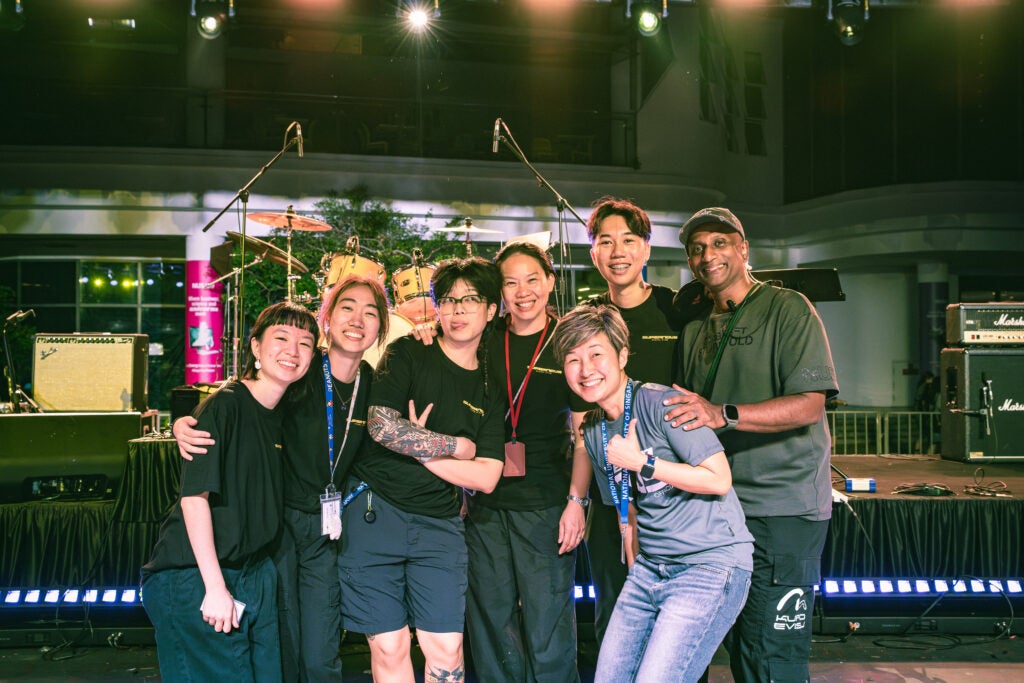 From left to right: Behind-the-scenes with show managers Lim Kai Ling and Koh Tzee Yen; River Chua & Ebelle Chong (OSA staff advisors); Jobina Tan (Division Head, Student Outreach, OSA), Liaw Jun Hao (Supernova 2025 Project Director) and Rajavarman S/O Mathichandran (UCI). 