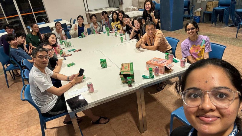 Assoc Prof Kua (second from right), former Resident Fellow Assoc Prof Eddie Lau (first from left) and Resident Fellow Ms Claire Cheong (fourth from right, standing) meeting with international students in February 2025. Fostering greater international student participation in Hall activities is a key focus for Kent Ridge Hall.