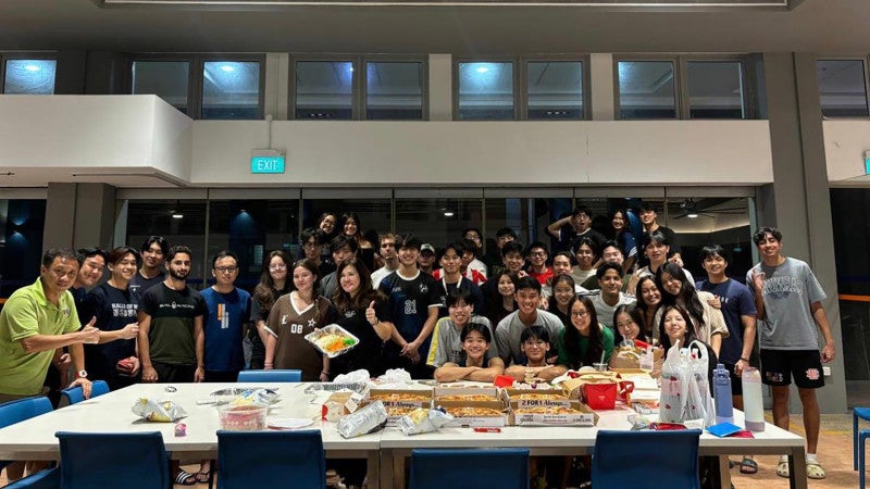 Assoc Prof Kua and Resident Fellow Claire Cheong (front row, seventh from left and holding the lohei tray) celebrated Chinese New Year with B Block residents of Kent Ridge Hall by joining them in their annual lohei dinner in 2025.