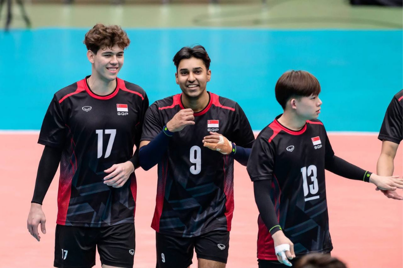 Ajay (middle) enjoying a light-hearted moment with his Team Singapore teammates after a match. (Photo: Singapore National Olympic Council)