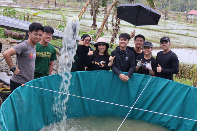Technology team members during the successful commissioning of the solar-powered water pump, delivering water to the irrigation containment system.