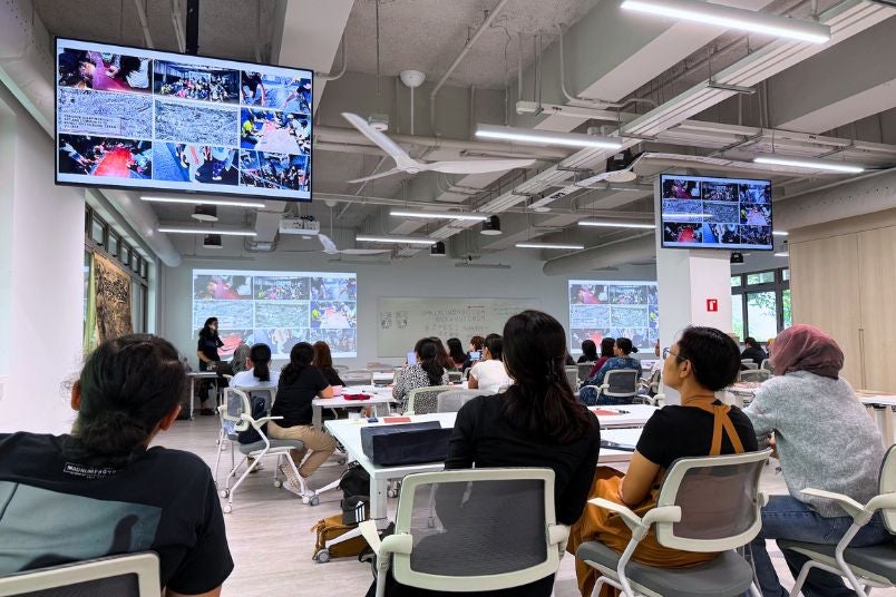 Participants listen intently to Pangrok Sulap’s introduction of their art practice.