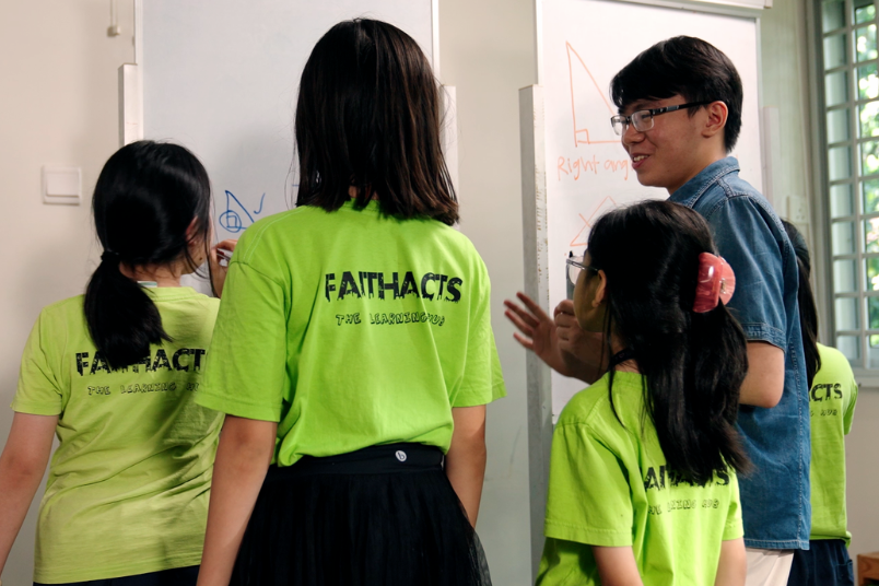 A Teach SG mentor and supports his mentees in homework, revision.