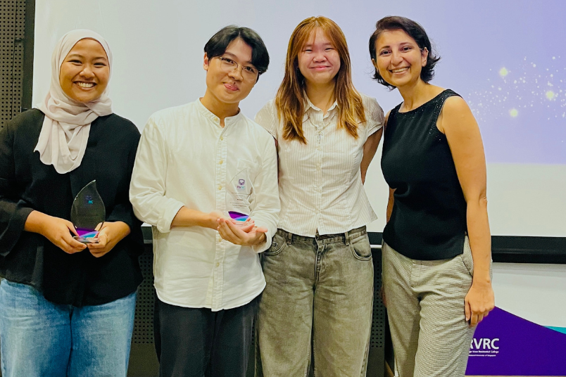 (From left to right) RVRC Artelier IG Heads AY25/26, Nor Najwa Binti Zainuddin (Year 3, Arts & Social Sciences), Muhammad Faiz Bin Muhd Faizal Abdullah Tan (Year 3, Science), and Nicole Chong Jia Li, (Year 3, Design and Engineering) with Staff Advisor Associate Professor Sadaf Ansari, after winning the RVRC Student Achievement Award 2026 (Community Engagement). 
