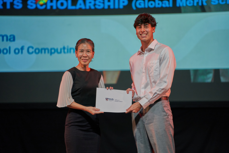 Raoul receives his NUS Sports Scholarship certificate from A/P Leong Ching, NUS Vice Provost (Student Life) at the NUS Achievement Awards 2024. 