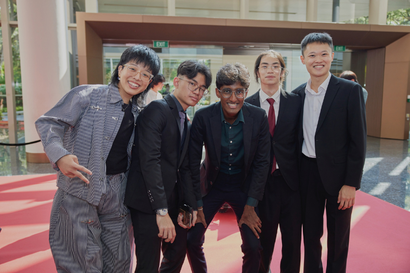 Kashfy and Tse Han photographed with their collaborators at NUS Achievement Awards (NAA) 2025 – They are River Chua (far left, then-OSA third space Advisor), Piraveen Alexander (fellow student from NUS Arts Production Crew) and Dr. Jovan Tan (far right, CDE2301 Lecturer). 