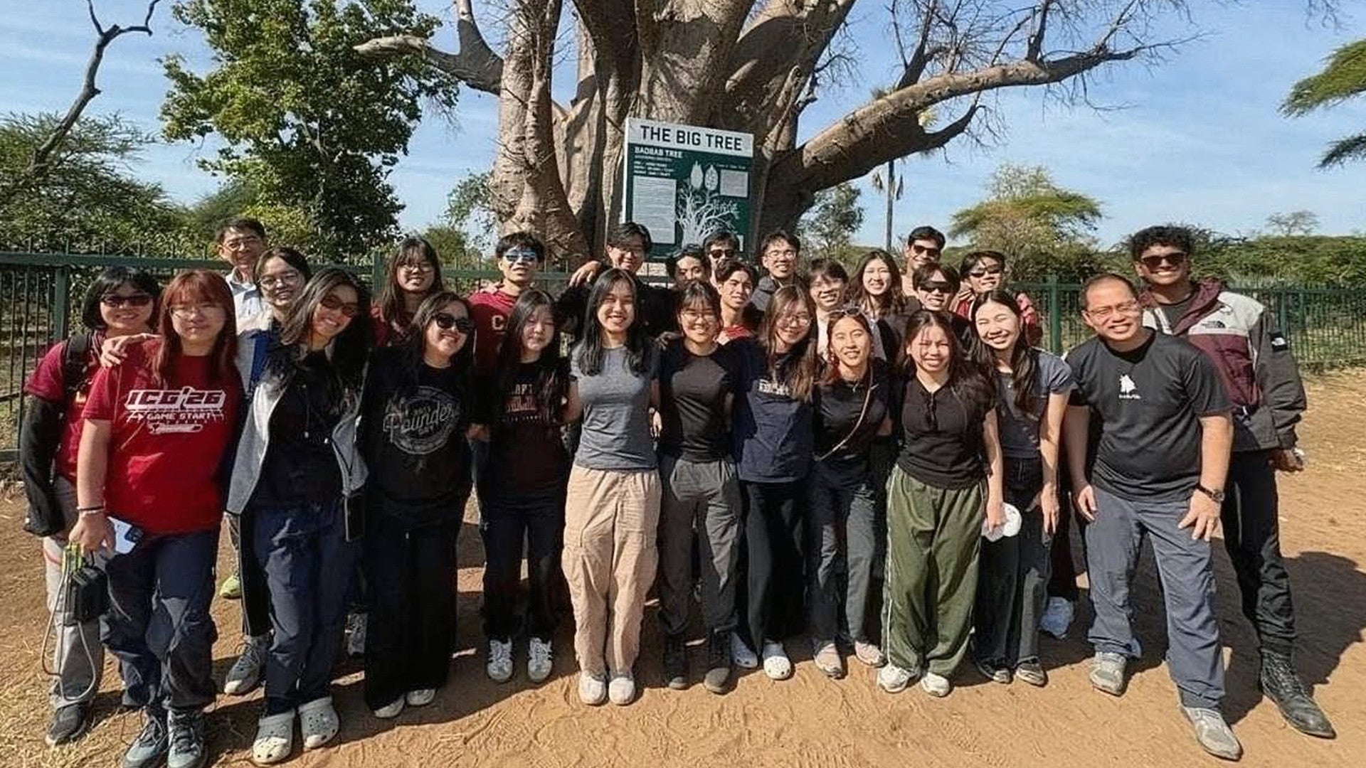 CAPTains with Dr Toh Tai Chong (front row, extreme right), Director of Residential Life at CAPT, in front of a 1,200-year-old Baobab tree which is an important source of food and shelter for a variety of wildlife.